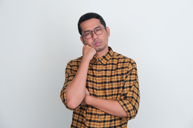 Adult Asian man showing gloomy expression