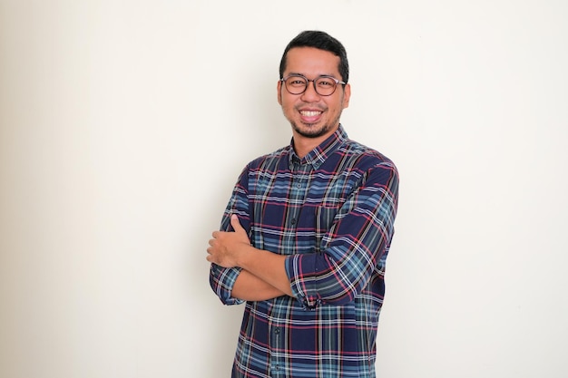 Adult Asian man smiling confident with arms crossed