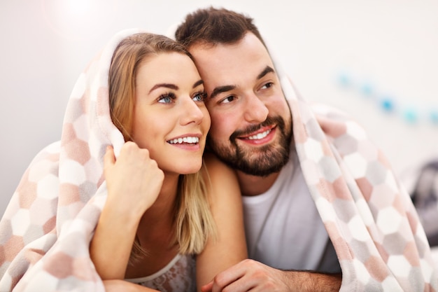 adult attractive couple in bed