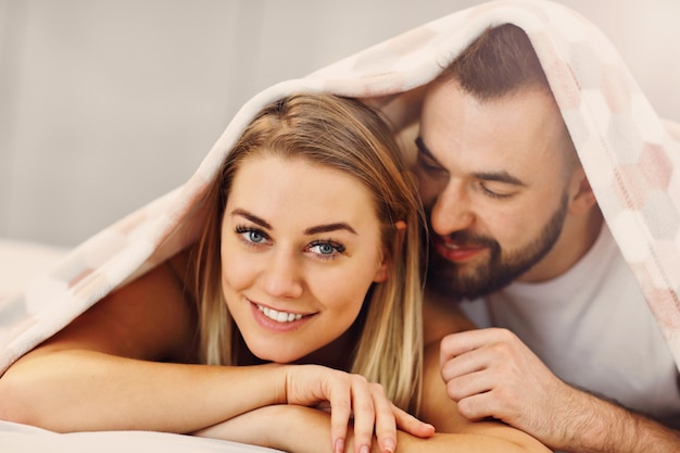 adult attractive couple in bed