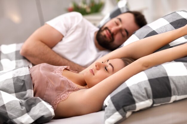 adult attractive couple in bed