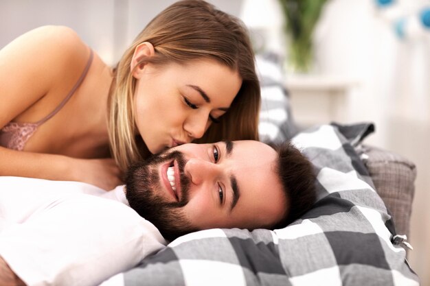 adult attractive couple in bed