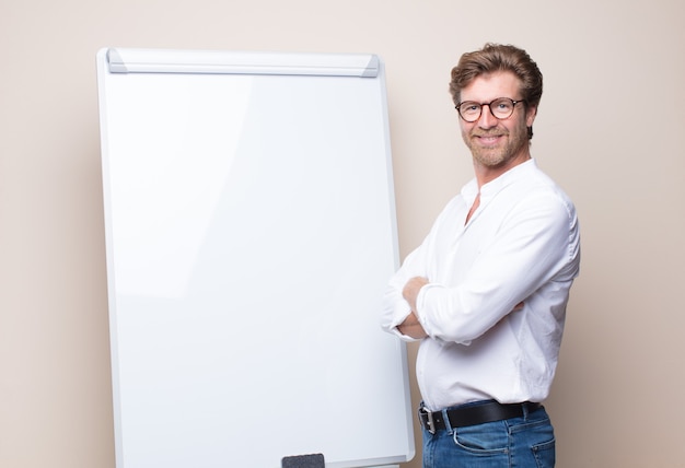 Adult blonde businessman with a board