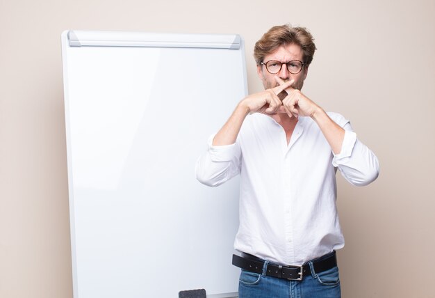 Adult blonde businessman with a board