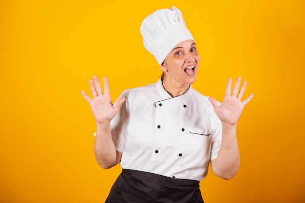 Adult Brazilian woman chef master in gastronomy Cook amazed wow incredible unbelievable