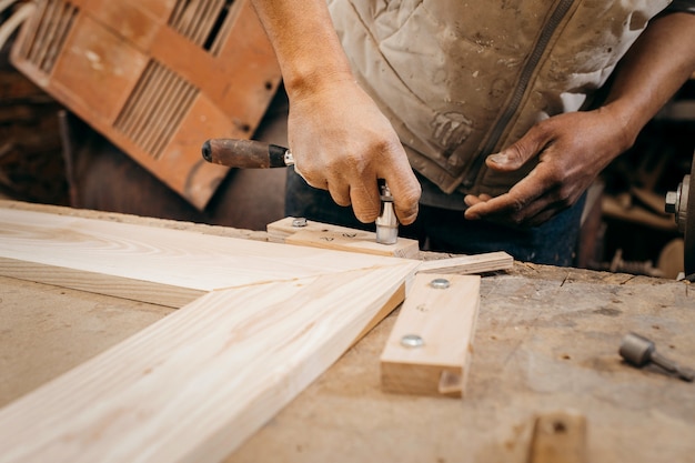 Adult carpenter working in his workshop