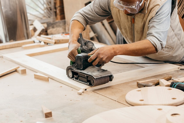 Adult carpenter working in his workshop