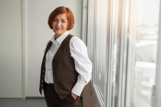 Adult Caucasian woman in office in suit