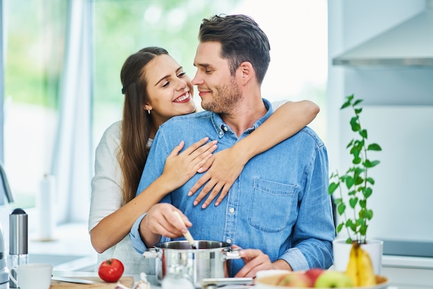 adult couple cooking together at home