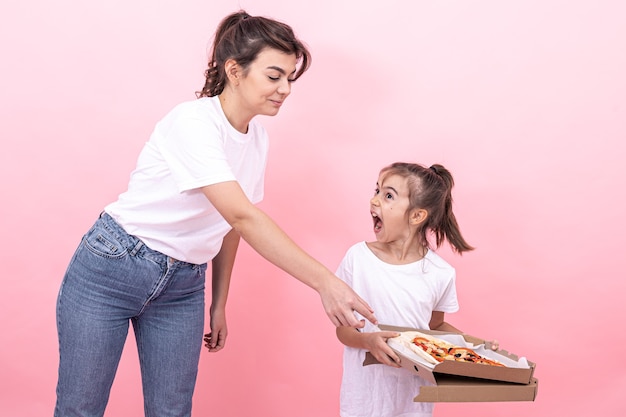 An adult girl and a little girl cannot share pizza between themselves.