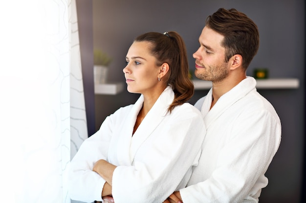 adult happy couple relaxing in spa salon