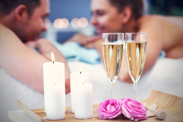 adult happy couple relaxing in spa salon