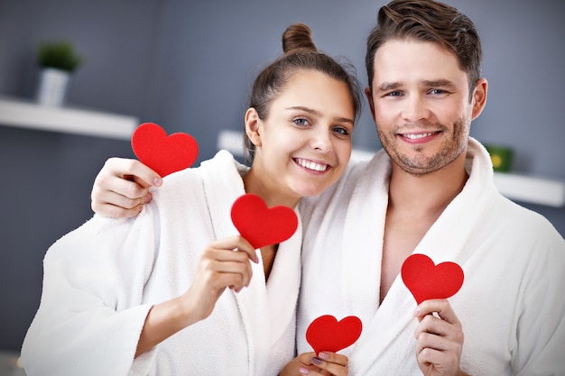 adult happy couple relaxing in spa salon