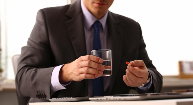 Adult male businessman hold tablet on