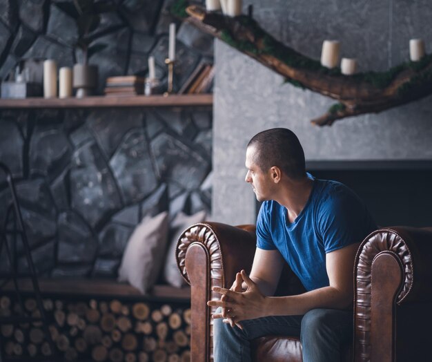 Adult man in blue tshirt at home