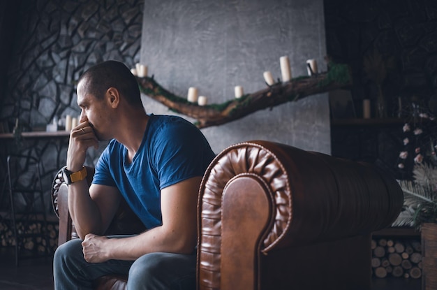 Adult man in blue tshirt at home