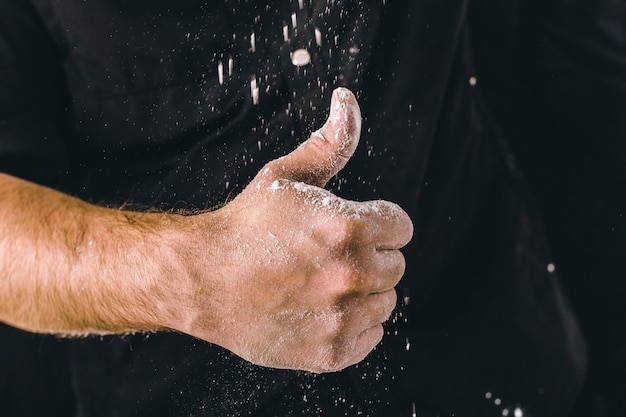 Adult man hands work with flour