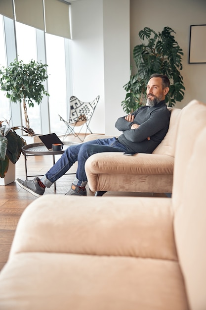 Adult man is working in a modern office