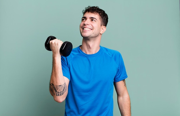 Photo adult man lifting a dumbbell and fitness concept