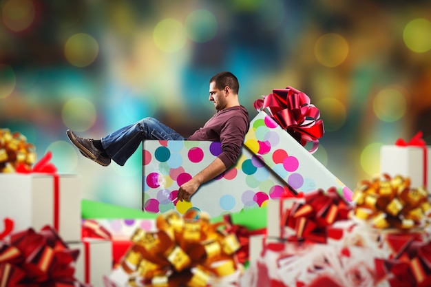 Adult man sits in presents smoking