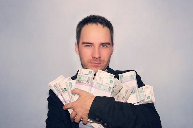 Adult man with a bunch of Russian rubles Lucky lucky millionaire rich man and is a lot of Russian money