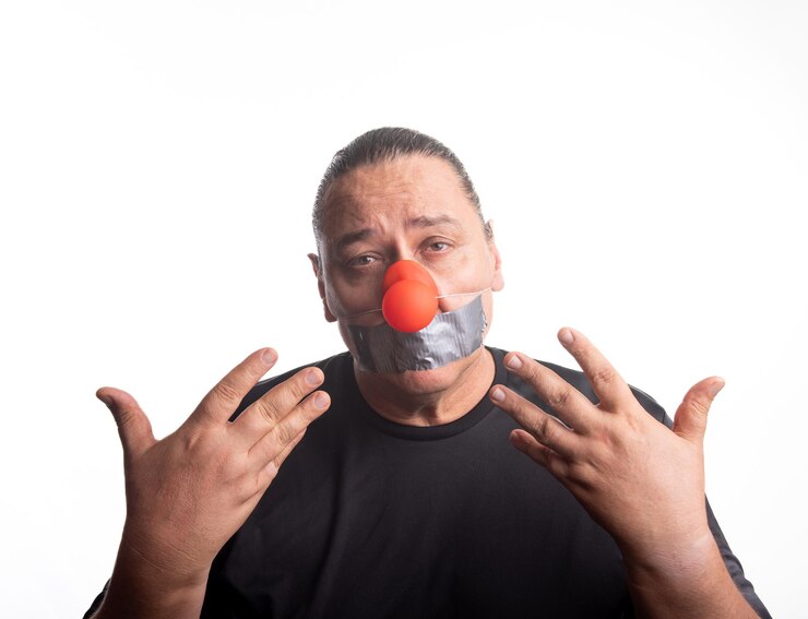 Photo adult man with clown nose posing selective focus white background