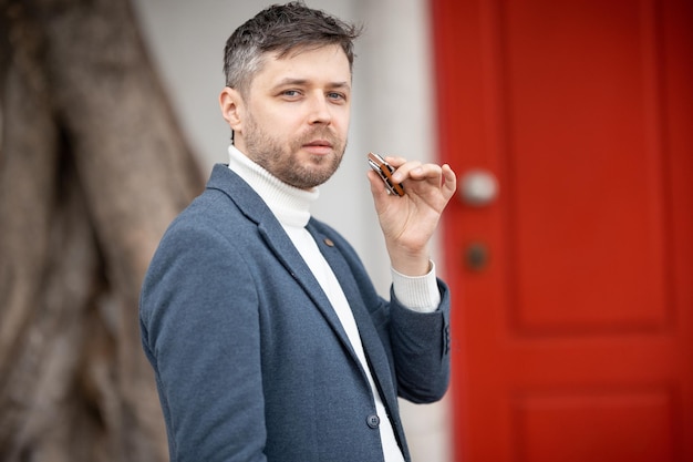 Adult man with harmonica looking at the camera