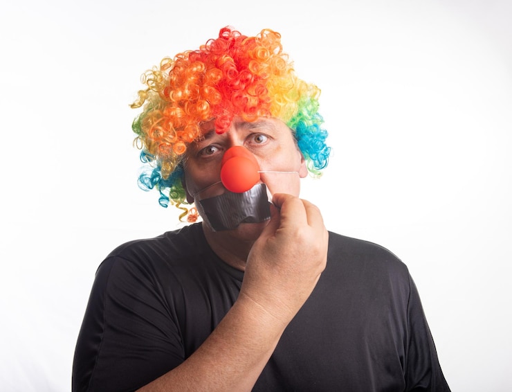 Photo adult man with wig and clown nose posing selective focus white background
