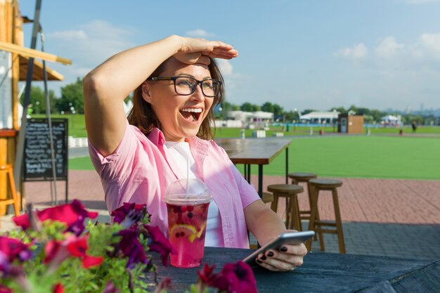 Adult middle-aged woman looks away