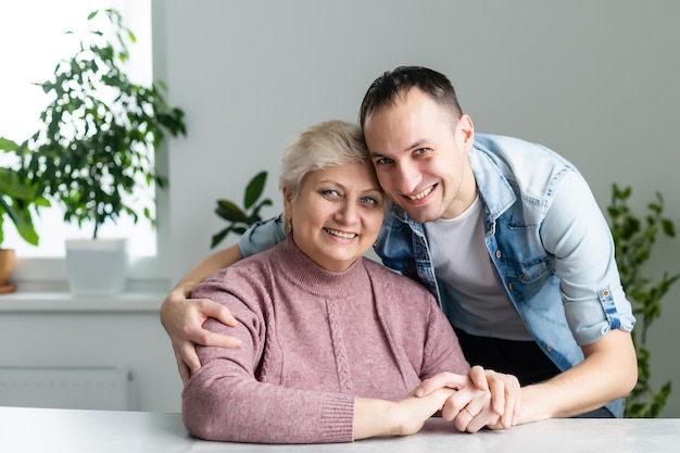 Adult son and his aging mother.