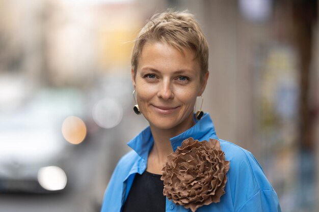 Adult stylish smiling woman with short blonde hair