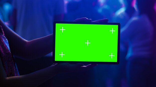 Photo adult using tablet with green screen