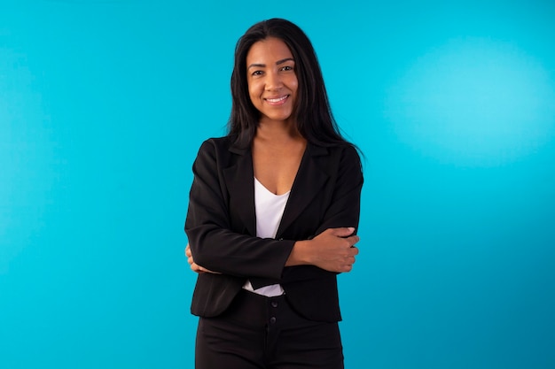 Adult woman in business suit style suit with facial expressions and holding a sign.