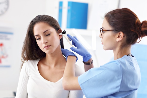 adult woman having a visit at female doctor's office