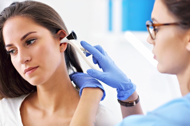 adult woman having a visit at female doctor's office