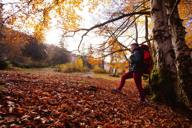 The adult woman hiker travels in the mountains without gadgets