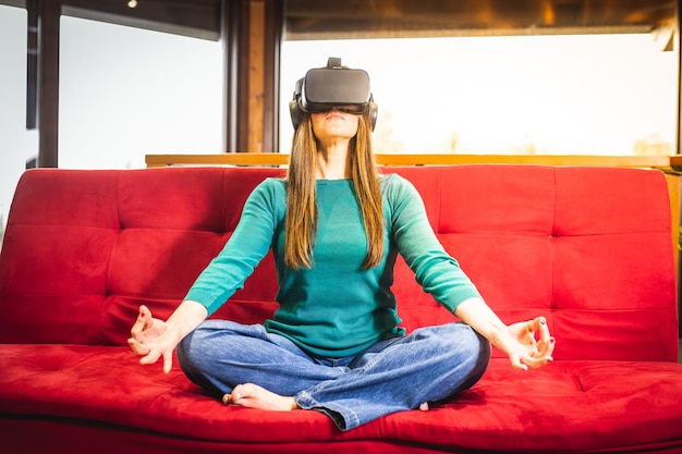 Adult woman meditation with augmented reality modern technology used for yoga fitness and health care