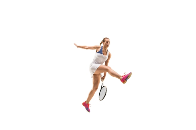 Adult woman playing tennis. shot over white.