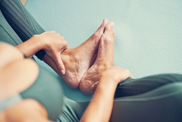 adult woman practising yoga at home