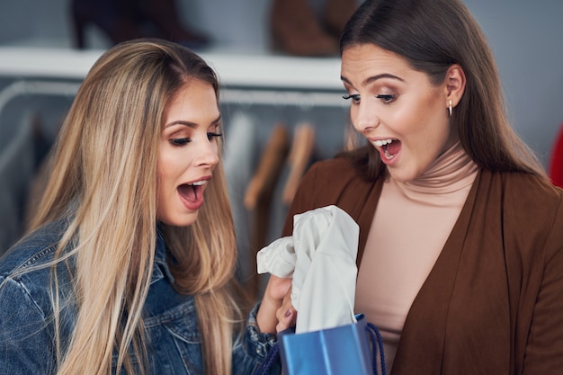 adult woman shopping for clothes in the city center in autumn