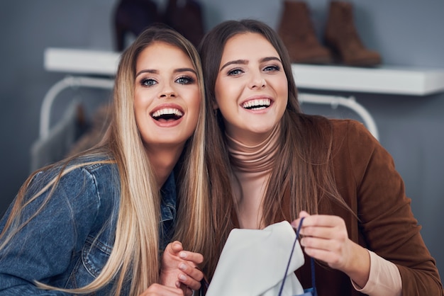 adult woman shopping for clothes in the city center in autumn