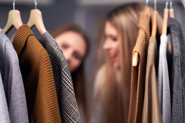 adult woman shopping for clothes in the city center in autumn