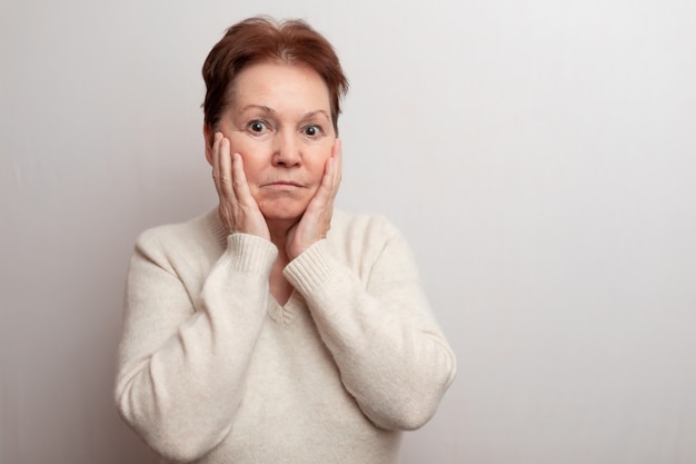 Adult woman on white in a light sweater