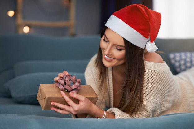 adult woman with Christmas present at home