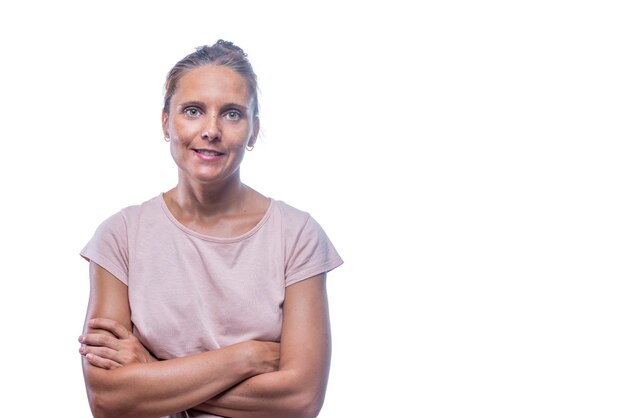 An adult woman with her crossed arms looking at camera