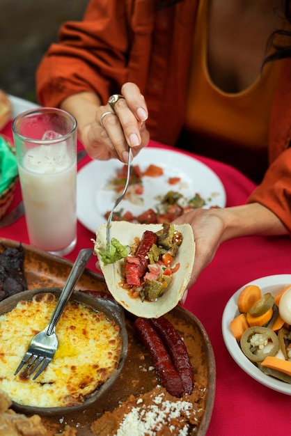 Adults enjoying mexican food