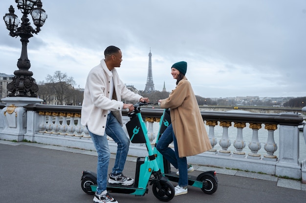 Photo adults learning to use electric scooter