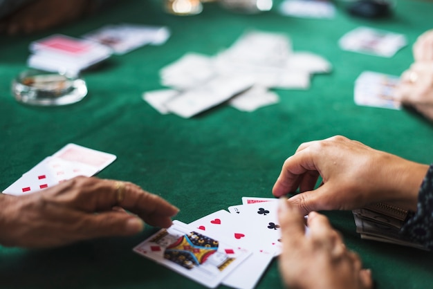 Adults playing cards