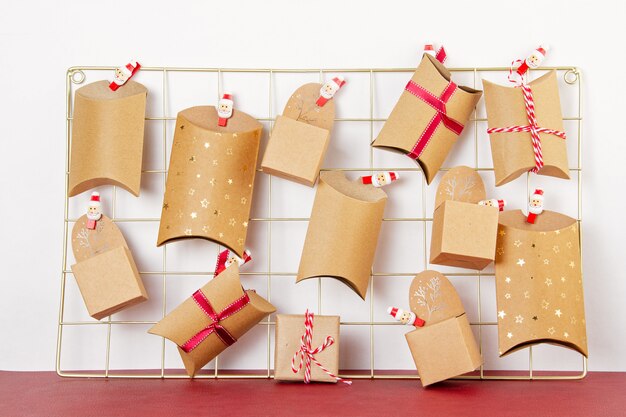 Advent calendar with craft carton boxes on the mesh board