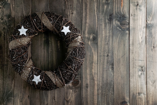 Advent wreath on the wooden vintage background